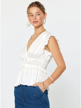 The Pleated Peplum Blouse in White
